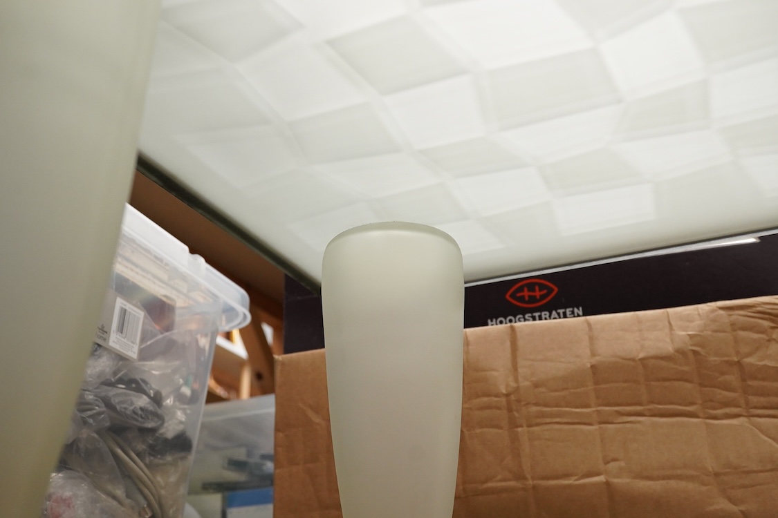 A Mary Canny an Art glass ‘Bottle table’, with abstracted checker board glass top- 49cm wide x 48cm deep x 35cm high